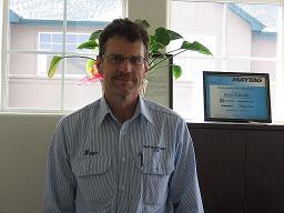 Brian Roehsner, owner of QUAD Appliance Service, repairing an appliance
